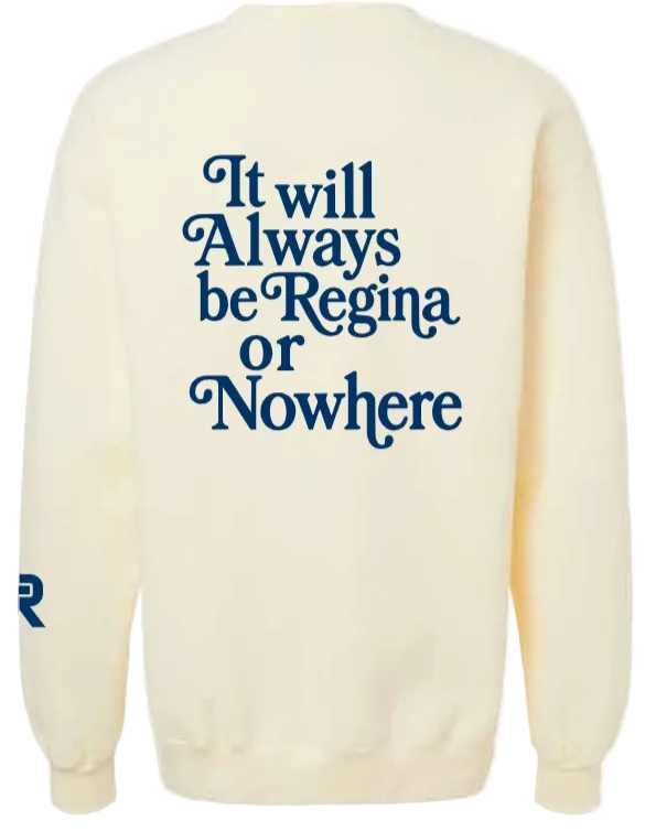 An off-white crewneck sweatshirt featuring the text 'Regina or Nowhere' printed in dark blue across the chest, with a matching blue graphic on the right sleeve.